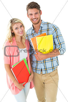 Attractive student couple smiling at camera