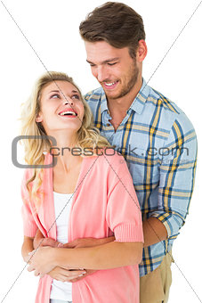 Attractive young couple embracing and smiling