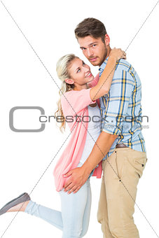Handsome man hugging his girlfriend