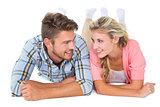 Attractive young couple smiling at each other