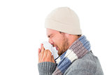 Handsome man in winter fashion blowing his nose