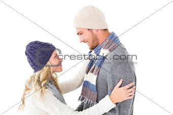 Attractive couple in winter fashion hugging