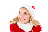Festive blonde looking up in santa hat