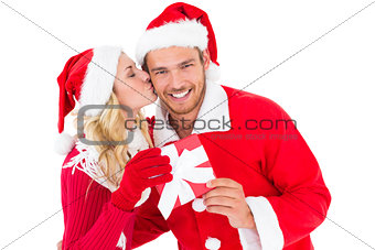 Festive young couple exchanging presents