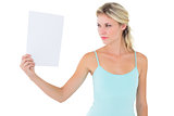 Angry blonde holding a sheet of paper