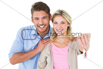 Attractive young couple showing new house key