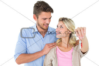 Attractive young couple showing new house key