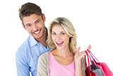 Attractive young couple holding shopping bags