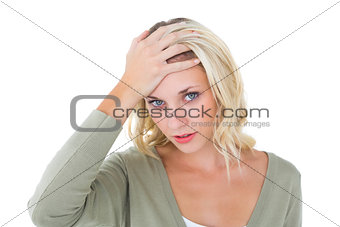 Confused young blonde looking at camera
