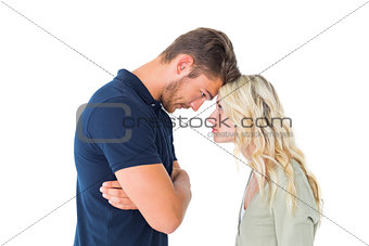 Young couple standing head to head