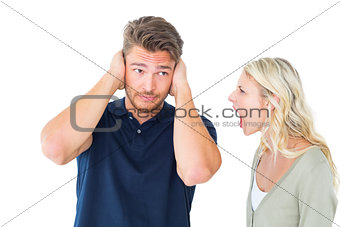 Man not listening to his shouting girlfriend