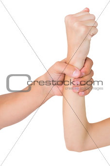 Mans hand grabbing womans wrist