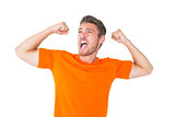 Excited man in orange cheering