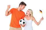 Excited football fan couple cheering