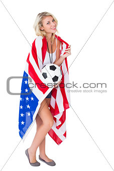 Pretty blonde football fan wearing usa flag