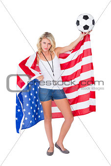 Pretty blonde football fan wearing usa flag