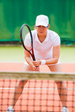 Focused tennis player ready for match