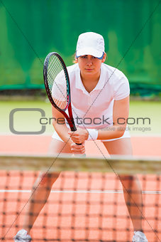 Focused tennis player ready for match