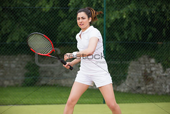 Pretty tennis player playing on court