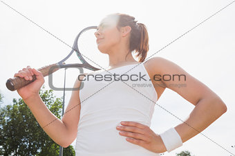 Pretty tennis player holding racket