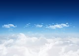 Bright blue sky over clouds