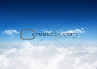 Bright blue sky over clouds