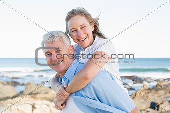 Casual couple having fun by the sea