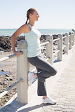 Fit mature woman standing on the pier