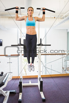 Fit woman doing crossfit fitness workout in gym