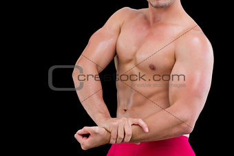 Mid section of a shirtless muscular man