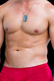 Close-up mid section of a shirtless muscular man