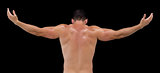 Rear view of shirtless muscular man with arms raised