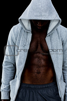 Muscular young man in hood jacket