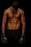 Shirtless boxer over black background