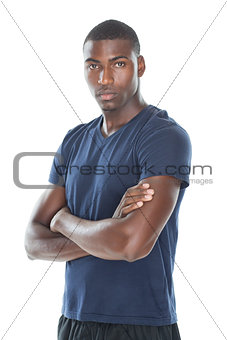 Portrait of serious man standing with arms crossed