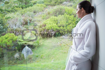 Relaxed woman wearing a bathrobe