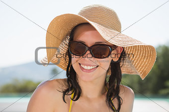 Close up portrait of cheerful woman wearing hat