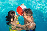 Couple playing in swimming pool