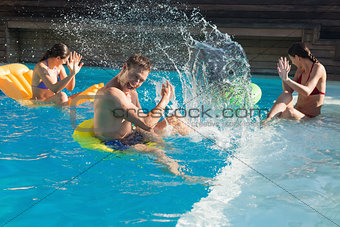 People playing in the swimming pool