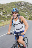Athletic man mountain biking