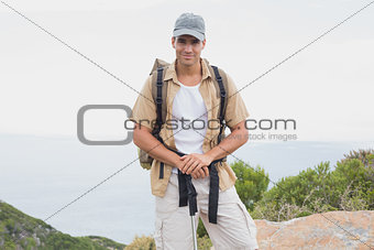 Hiking man walking on mountain terrain