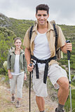 Hiking couple walking on mountain terrain