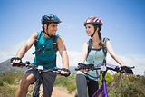Athletic couple mountain biking