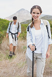 Hiking couple walking on countryside landscape