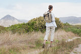 Rear view of a hiking young woman