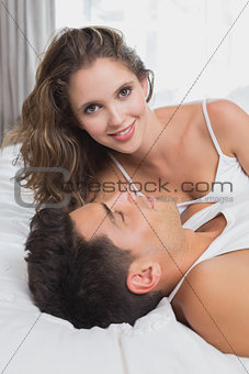 Couple lying in bed at home