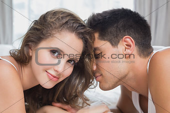 Romantic couple in bed at home