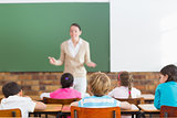 Pupils listening to their teacher at chalkboard