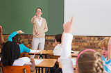 Pupils raising their hands during class