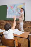 Pupils listening to their teacher at map